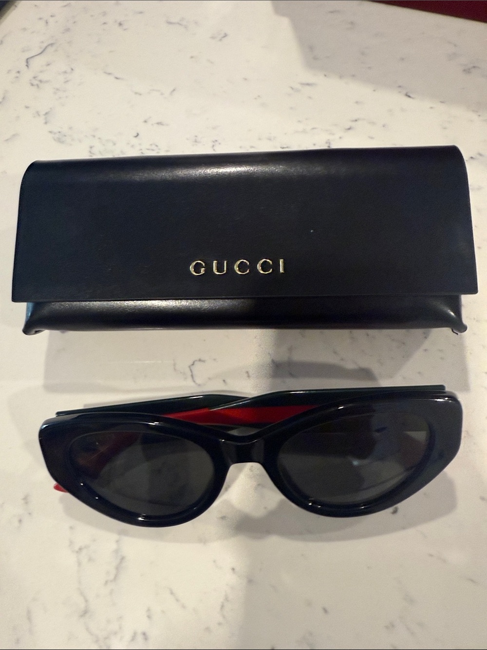 GUCCI Black Cat-Eye Sunglasses with Red Accent